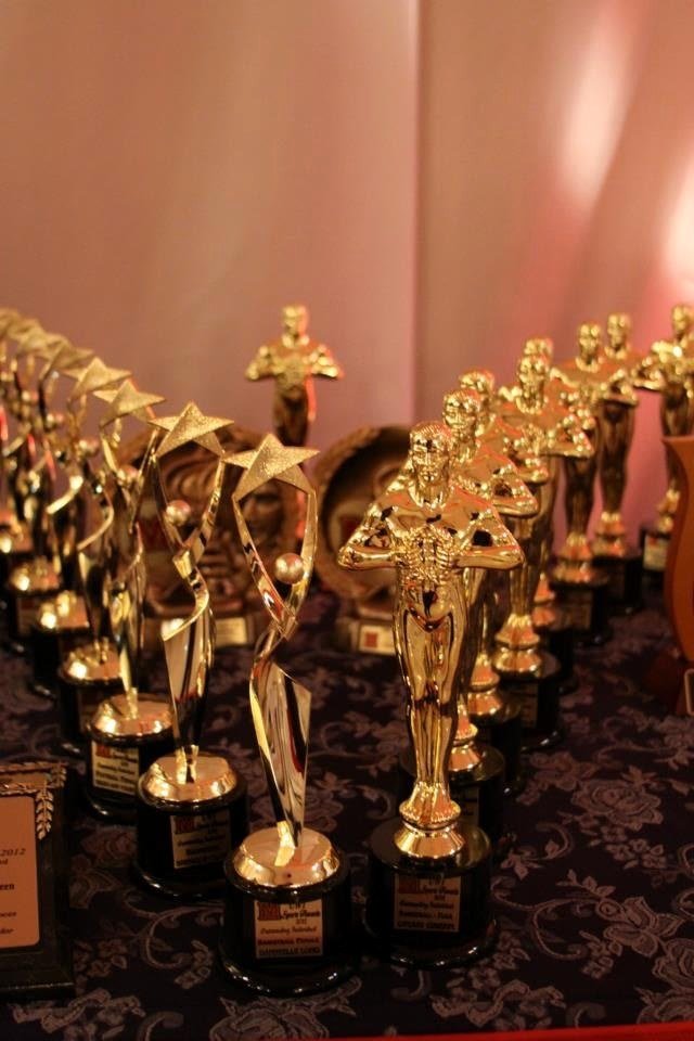 A display of gold trophies and awards